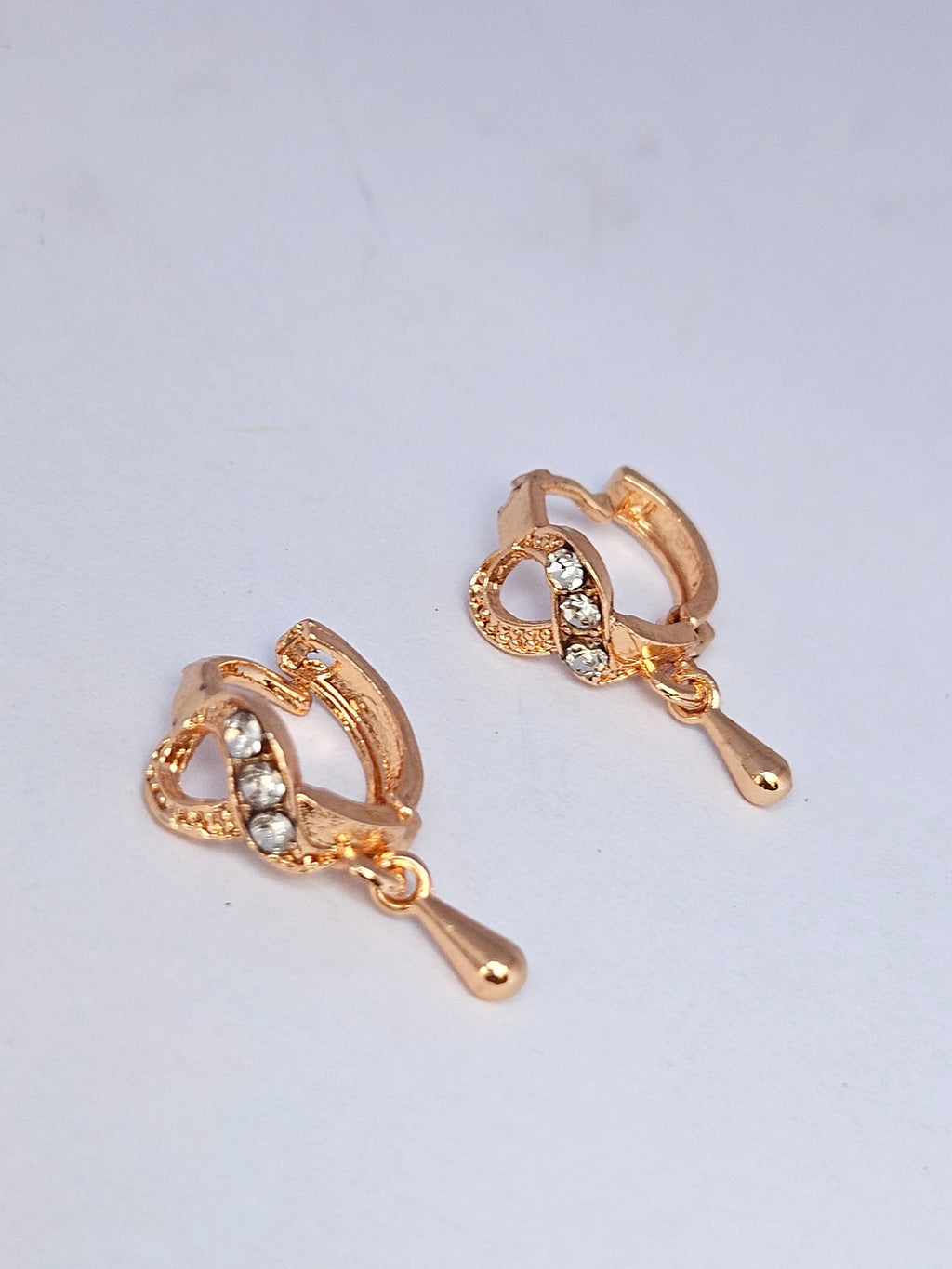 Infinity Twist Golden Hoop Earrings with Delicate Teardrop Charms – Modern Lightweight Dangle Hoops for Women
